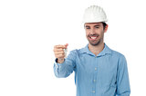 Smiling engineer holding key