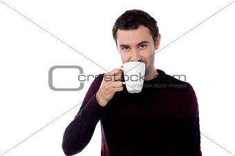 Stylish man holding coffee cup