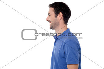 Side view posing of smiling guy
