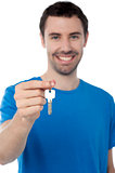 Young man in holding key