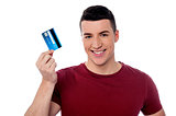 Young man holding credit card