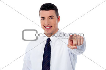 Young corporate guy pointing at you