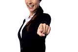 Business woman pointing finger at you