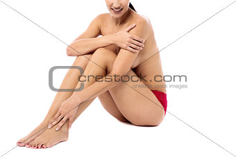 Beautiful woman sitting topless