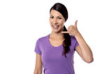 Woman gesturing phone call with hand
