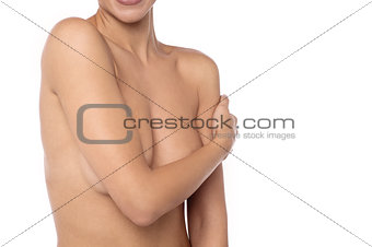 Naked young woman isolated over white
