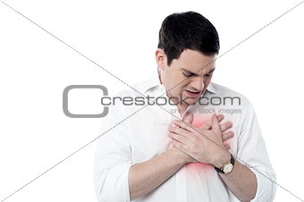 Young man having heart attack