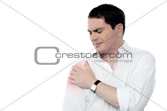 Young man having shoulder joint pain