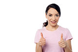 Smiling woman with thumbs up gesture