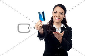 Young woman showing a credit card