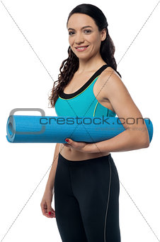 Fitness woman with a gym mat