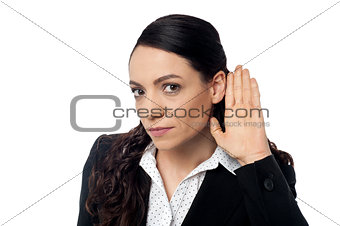Business woman with hand to ear