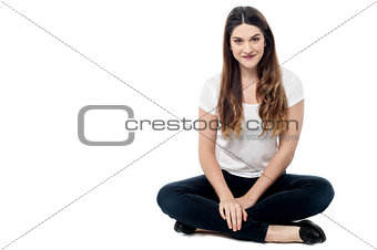 Relaxing woman sitting on floor