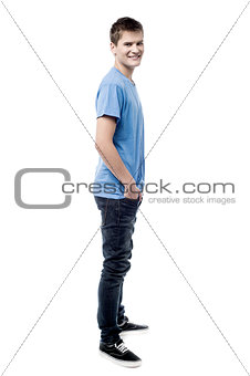 Full length of young man looking to camera