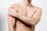 Muscular man discomfort on shoulder