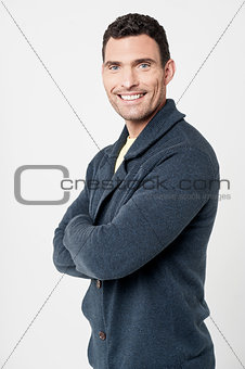 Cheerful man with folded arms
