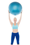 Woman exercising with gymnastic ball