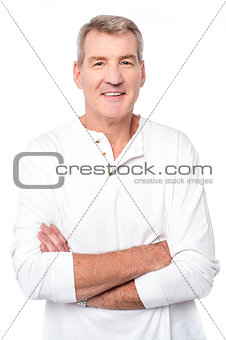 Smiling man posing with folded arms