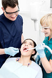 Dentist examining a woman teeth