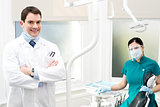 Male dentist with female assistant