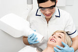 Female dentist using x-ray machine