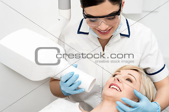 Female dentist using x-ray machine