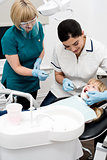 Little girl examined by dentist