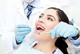Female getting her teeth examined