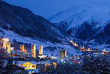 Stone svaneti towers with lights in the mountain village Mestia