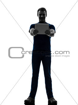 man holding watching  digital tablet  silhouette
