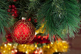 Closeup of red Christmas balls on colored background