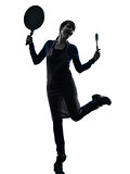 woman happy cooking holding frying pan silhouette