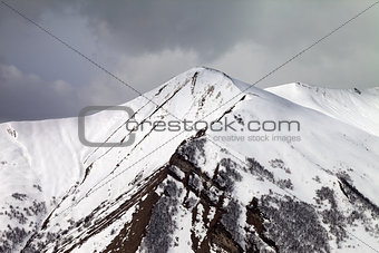 Winter mountains and gray sky