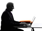 senior business man computing smiling silhouette