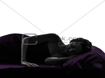 woman in bed sleeping lying on side silhouette