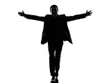 business man arms outstretched silhouette