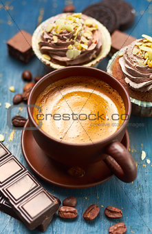Coffee with chocolate and cupcake