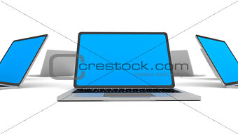 Laptops in a circle isolated on white.