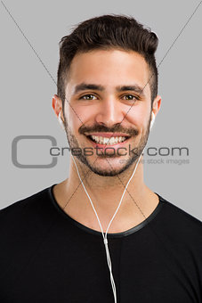 Man smiling and listen music