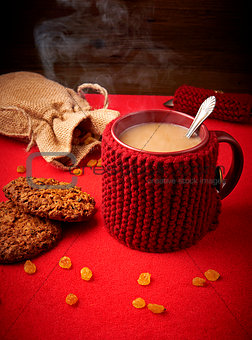 Mug of coffee with cookies