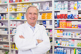 Senior pharmacist smiling at camera