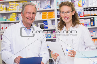 Team of pharmacists looking at camera