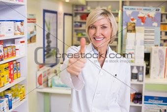 Pharmacist holding her thumb up