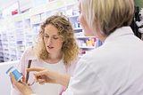 Pharmacist and her customer talking about medication