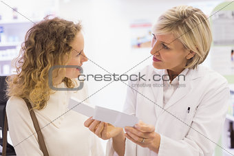 Pharmacist explaining the prescription to patient