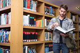 Student reading in library