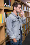 Student talking on the phone in library