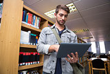Student using tablet in library