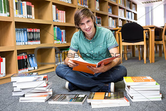 Student sitting on floor in library