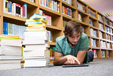 Student lying on library floor